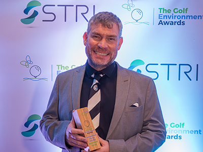 Royal Dornoch deputy course manager Scott Aitchison with the Sustainable Project of the Year award