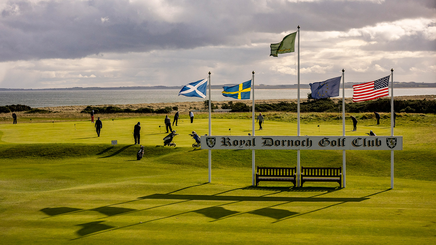 Golfers at Royal Dornoch putting before teeing off
